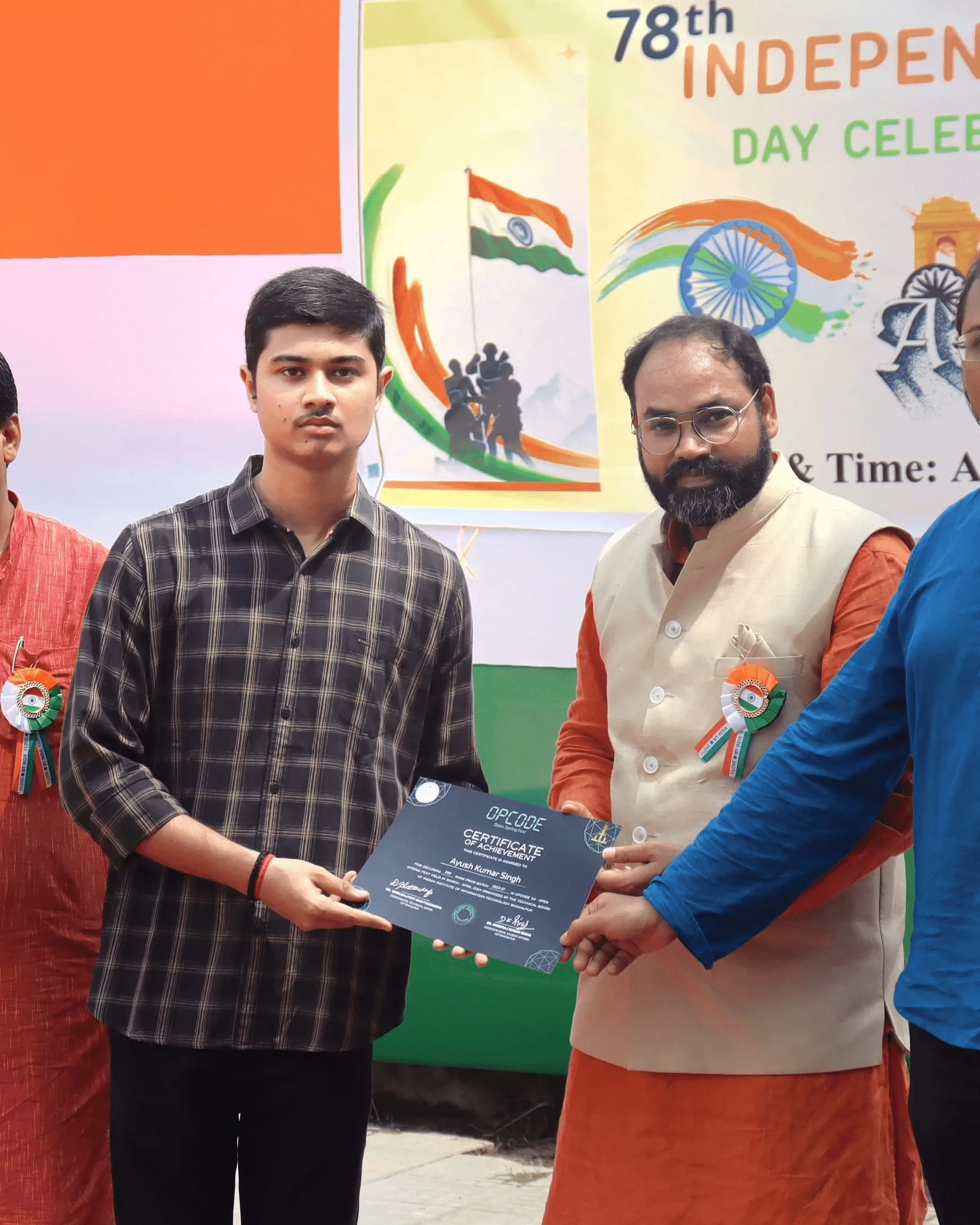 Ayush Singh being presented with an award plaque